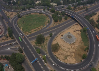 An aerial shot of the AIIMS flyover with running traffic in New Delhi, India