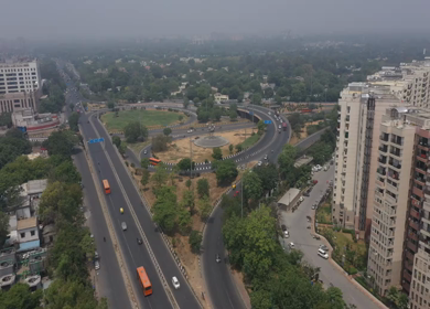 An aerial shot of the AIIMS flyover with running traffic in New Delhi, India