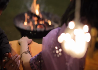 A Slow Motion Shot of Applying Mehndi on Bride's hand at her Indian Wedding in India