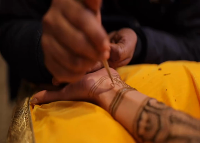 A Slow Motion Shot of Applying Mehndi on Bride's hand at her Indian Wedding in India