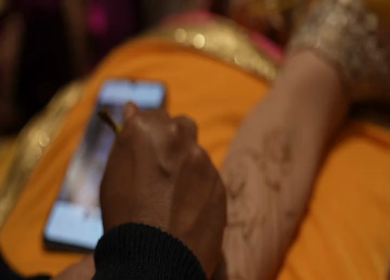 A Slow Motion Shot of Applying Mehndi on Bride's hand at her Indian Wedding in India