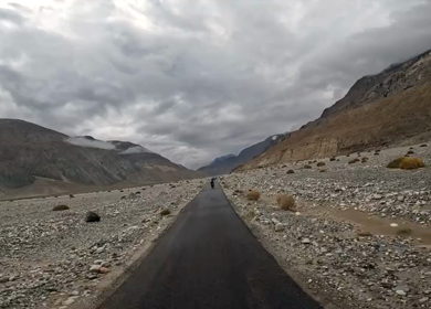 A shot of a bike rider riding in the roads of Leh Ladakh,India