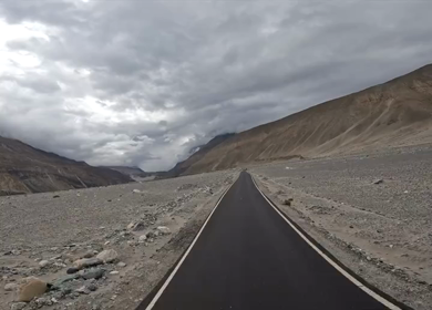 A shot of a bike rider riding in roads of Leh Ladakh,India