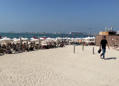 30 March 2023 : A Pan Shot of Jumeirah Beach Residence - JBR and ferris wheel at Dubai,UAE 