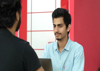 A Slow Motion Shot Of An Indian Boy Closing A Deal With The Client