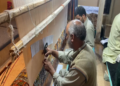 3rd October 2022: A Shot of two men working at a Silk Cloth Factory in Kashmir, India