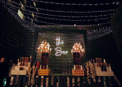 A slow motion shot of a bar being setup at an Indian wedding in New Delhi, India