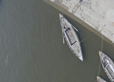An Aerial shot of a boy jumping into the river at Ganga Ghat Varansi, Uttar Pradesh,India