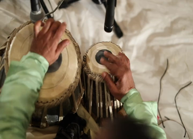 A Slow Motion Shot of a man Playing Tabla at an Indian Wedding in New Delhi,India