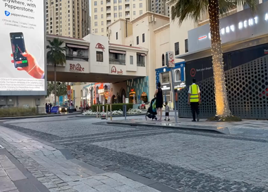 30 March 2023 : A Timelapse Shot of People and Traffic at Jumeirah Beach Residence- JBR at Dubai,UAE 