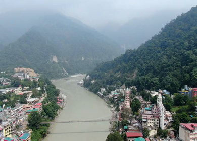 An aerial shot of Laxman Jhula over the river ganga in Rishikesh,Uttarakhand,India