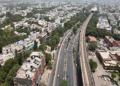 An Aerial Shot of Delhi Metro and Traffic movement at Moolchand Flyover in New Delhi,India