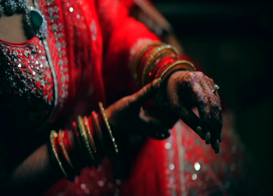 A Shot of an Indian Bride showing her Bridal Jewellery at her Indian Wedding in India