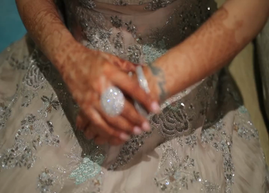 A Shot of an Indian Bride showing her Bridal Jewellery at her Indian Wedding in India