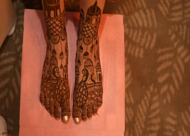A Shot of Indian Bride showing Mehndi on her feet at her Indian Wedding in New Delhi, India
