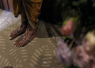 A Shot of Indian Bride showing Mehndi on her feet at her Indian Wedding in New Delhi, India