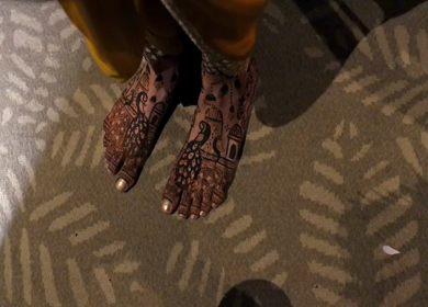 A Shot of Indian Bride showing Mehndi on her feet at her Indian Wedding in New Delhi, India
