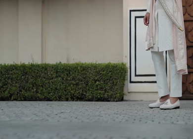 A shot of an Indian Groom posing for the photoshoot at his Indian Wedding