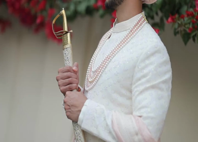 A shot of an Indian Groom posing for the photoshoot at his Indian Wedding