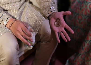 A shot of an Indian Groom posing for the photoshoot at his Indian Wedding