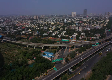 An aerial shot of the Delhi Metro at Botanical Garden in Noida,NCR,India 