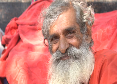 A close up shot of an old man at Hanuman Mandir in New Delhi, India