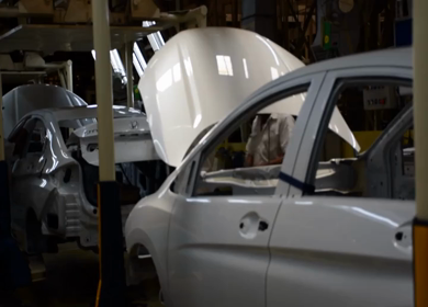 Greater Noida, CIRCA April 2017: Logos being fixed in the car at car manufacturing plant in India