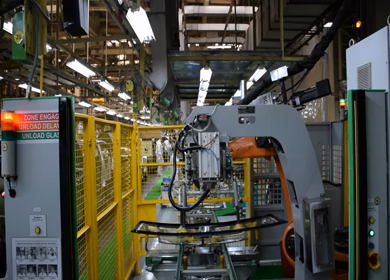 Greater Noida, CIRCA April 2017: windscreen being taken for fixing in car at car manufacturing plant in India