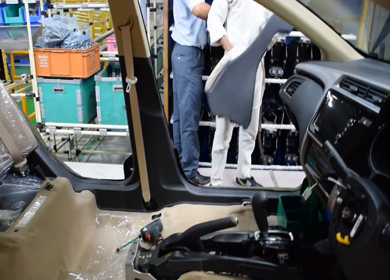 Greater Noida, CIRCA April 2017: Arm rest being fixed in a car at car manufacturing plant in India