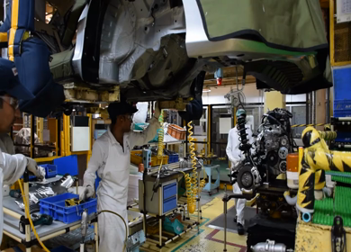 Greater Noida, CIRCA April 2017: engine being fixed in a car at a car factory in india