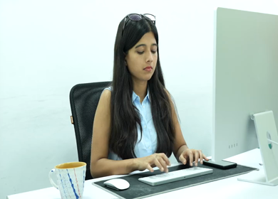 Shot of an Indian Girl doing work discussion over a phone call in office