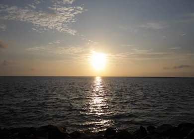 A timelapse shot of the sun rising over the ocean in India