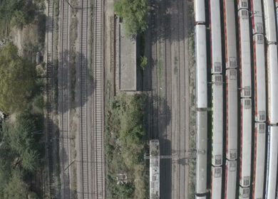 An aerial shot of the Indian Railways Train moving on railway tracks 