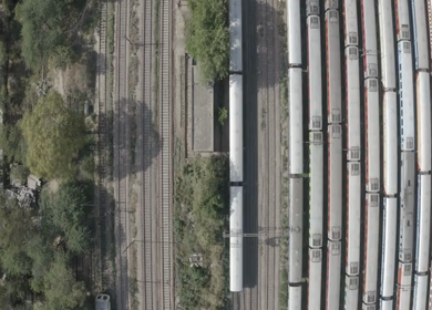 An aerial shot of the Indian Railways Train moving on railway tracks 